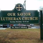 Double sided carved gold leaf sign for a church in Thomaston